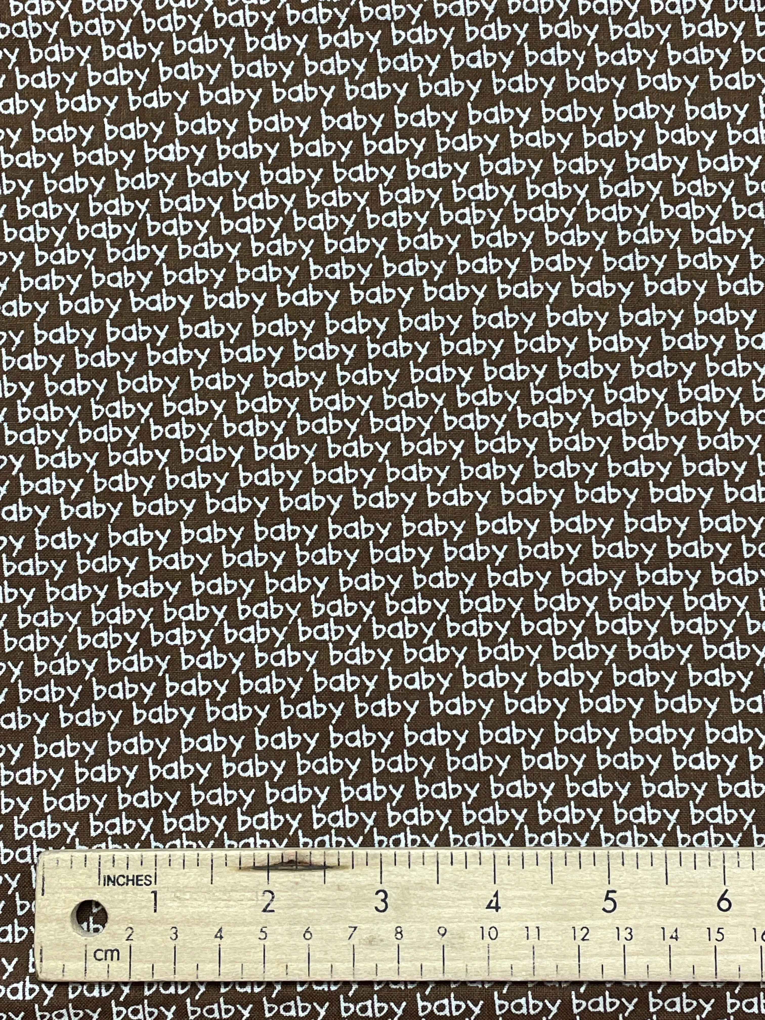 1 YD Quilting Cotton - Brown with "Baby" in White